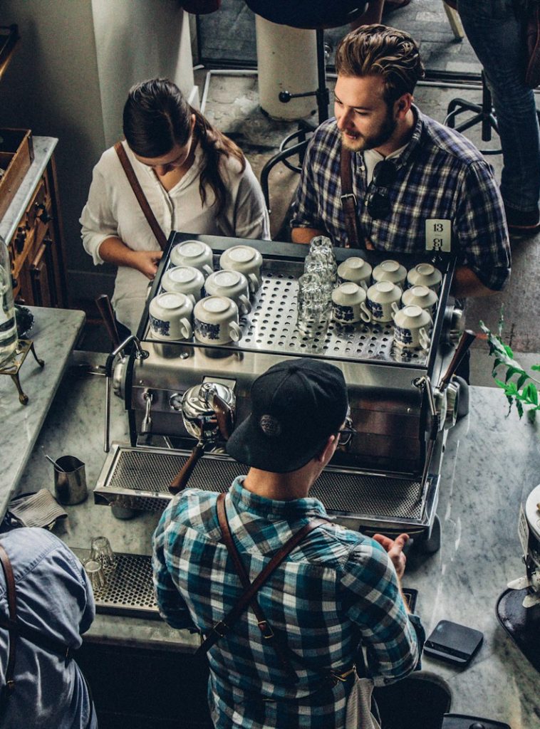 man buying coffee on counter